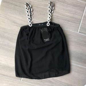 Women’s flowy blouse with flower straps